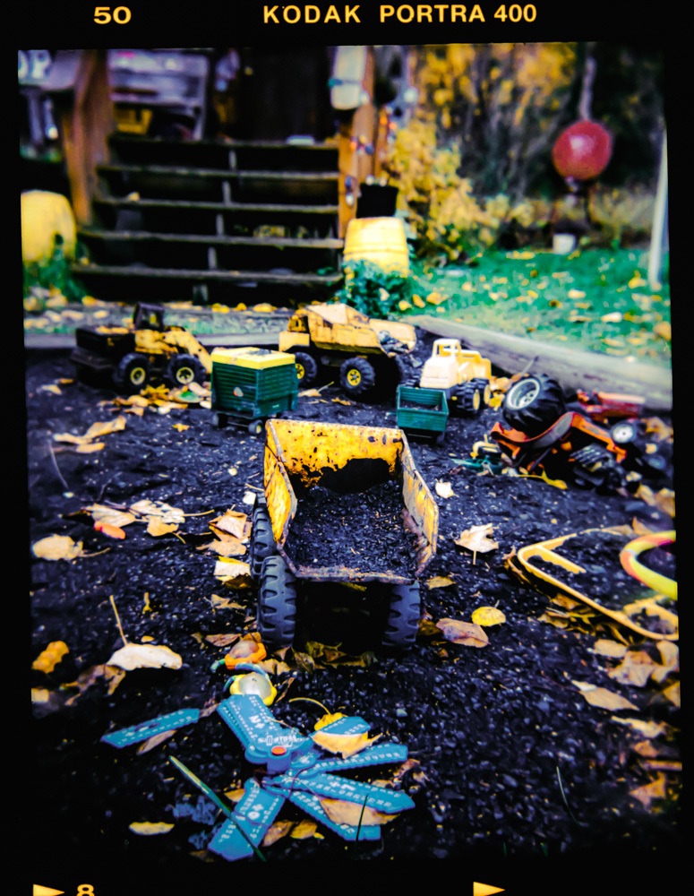 Toy camera picture of children's toys in front of a building in Hope, Alaska.